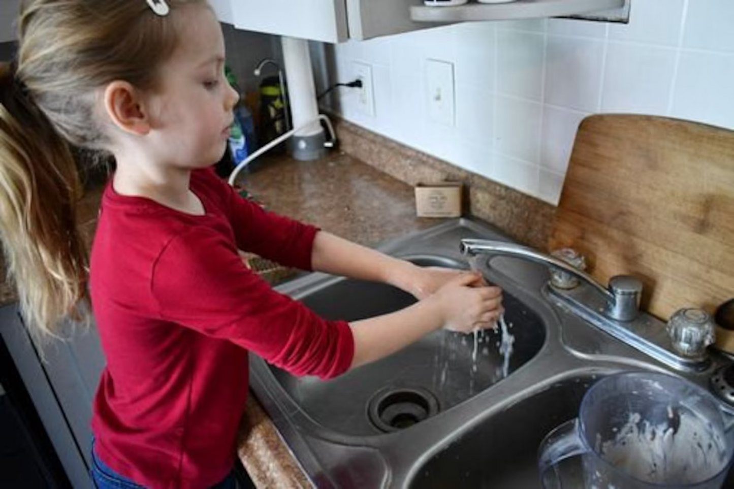 Kid_Washing_hands_with_handmade_sandalwood_patchouli_soap_jenny_joys_soap